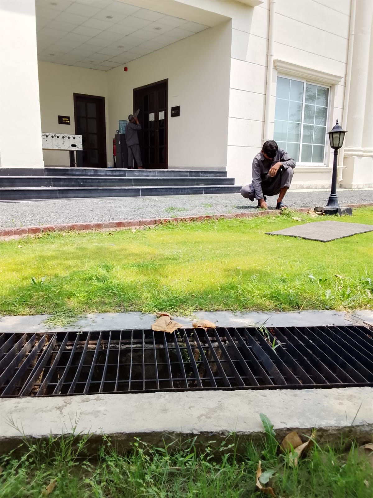 EHAS worker performing outdoor grounds maintenance